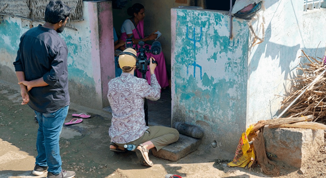 Nurse and health aide visiting a patient in a village